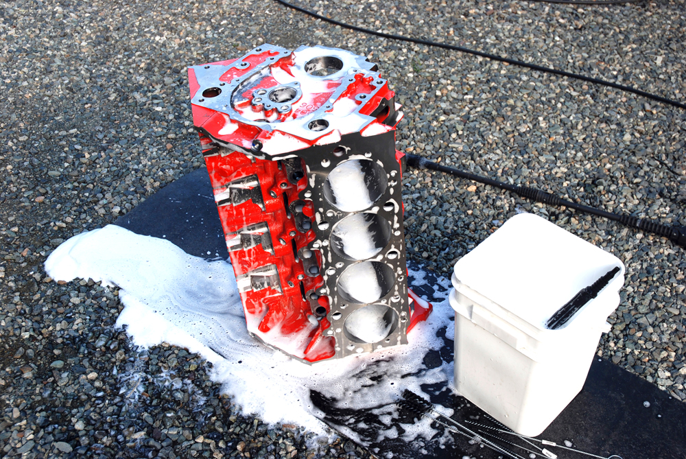 a washed soapy engine block sitting outside