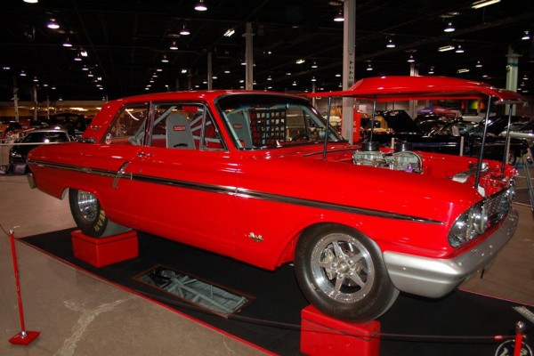 custom ford fairlane drag car displayed at a car show