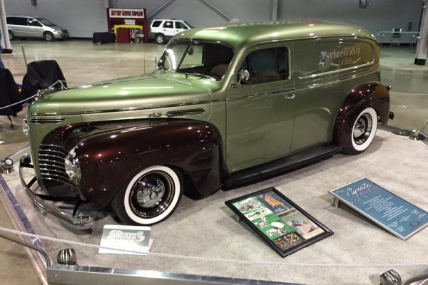 customized hot rod panel wagon at a car show