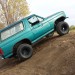 1984 ford bronco climbing dirt hill thumbnail