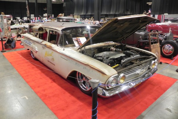 vintage chevy impala station wagon with external air conditioning blower box on window