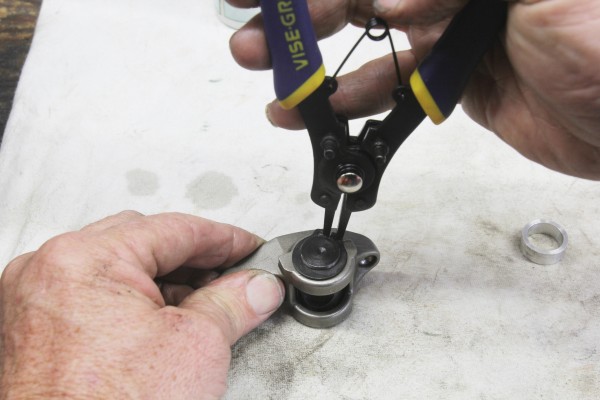 installing snap rings onto rocker trunnion
