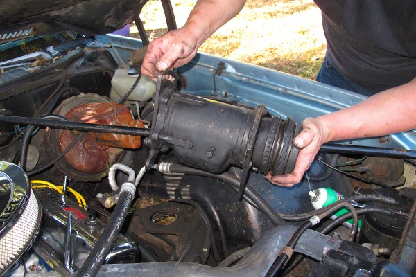 removing a large factory air conditioning compressor from an old car