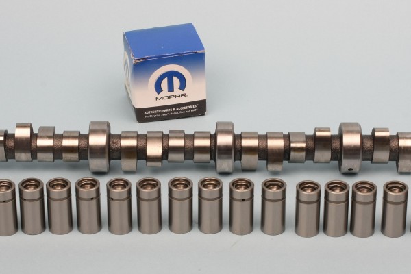 purple Mopar camshaft and lifters on a table