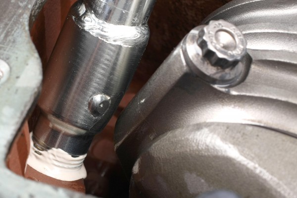 close up of an oil pump pickup tube on a v8 engine