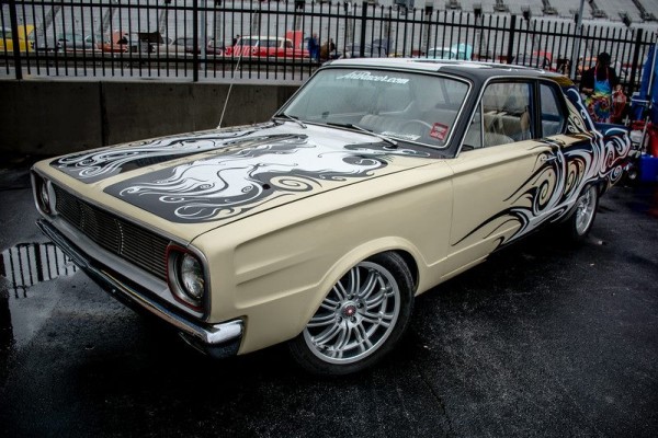 vintage mopar coupe with wild vinyl wrap
