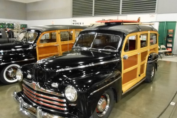 vintage woody wagon with surfboard