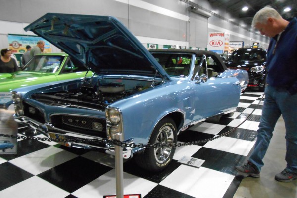 Pontiac gto displayed at indoor car show