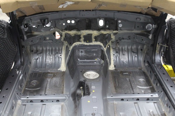 bare floor of a mazda miata prior to paint