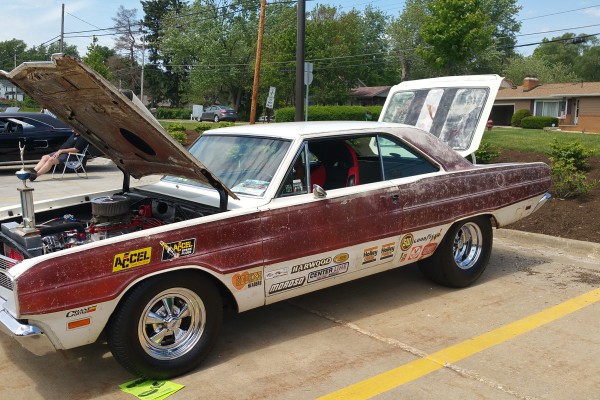 vintage mopar nostalgia drag car on display at a car show