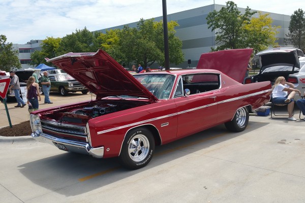vintage mopar coupe at a car show