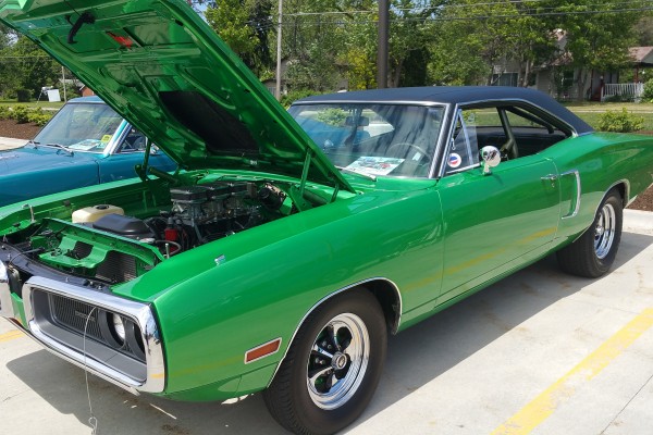 green dodge coronet super bee at a car show