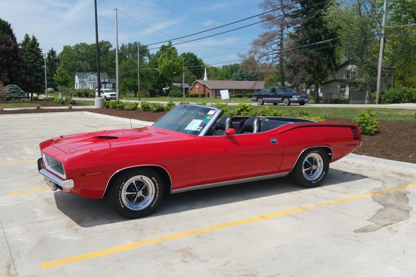 1970 plymouth barracuda convertible at a car show