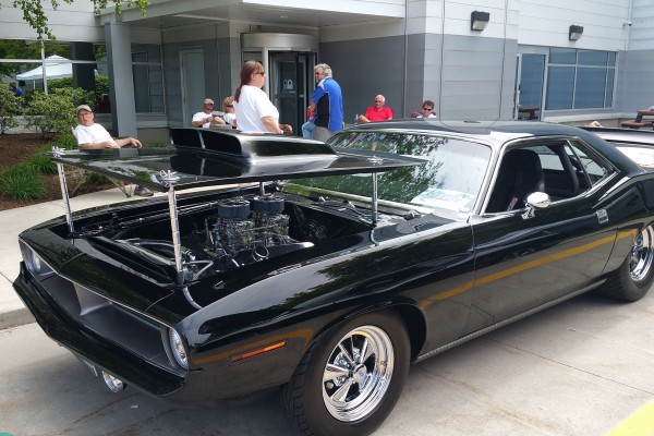 black 1970 plymouth barracuda drag car at show