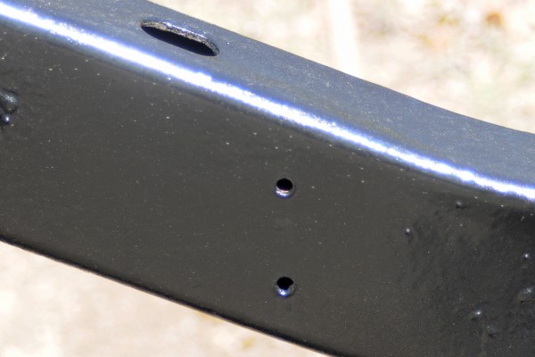 black paint curing on a vehicle frame