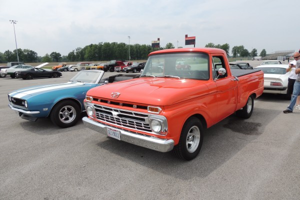 old cars and trucks at a car show
