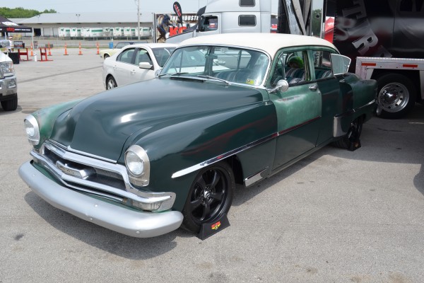modified hot rod sedan at a car show