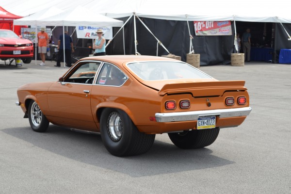 rear view of an orange chevy vega drag car