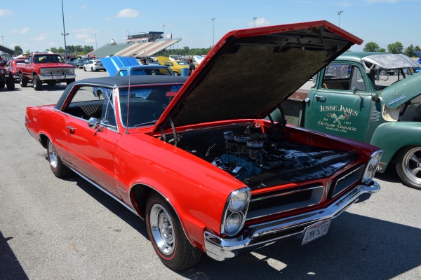 red 1965 pontiac gto with tri power