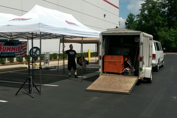 setting up awning for a big car show