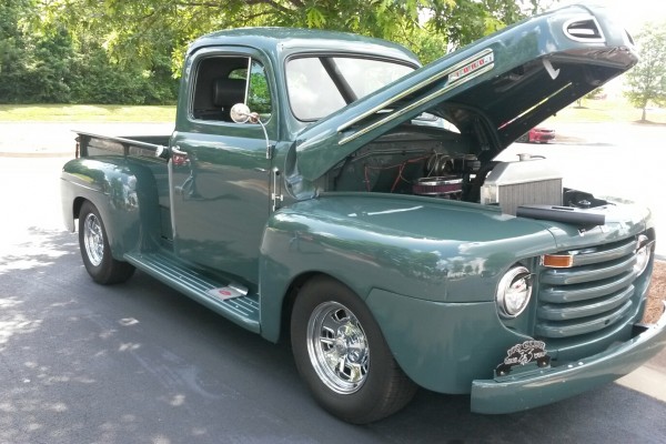 vintage postwar ford truck at a car show