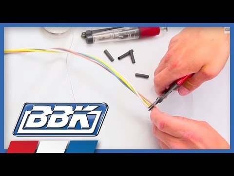 man splicing a BBK wire harness