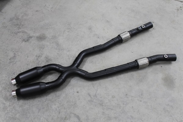 dual exhaust system laying on whop floor