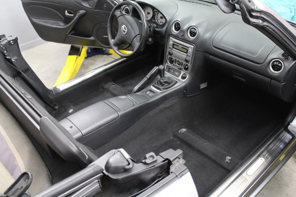 inside a mazda miata interior during ls swap project