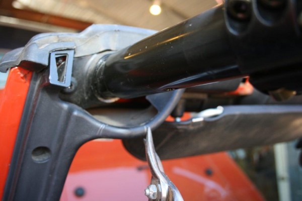 trimming plastic piece of jeep wrangler interior for roll cage installation