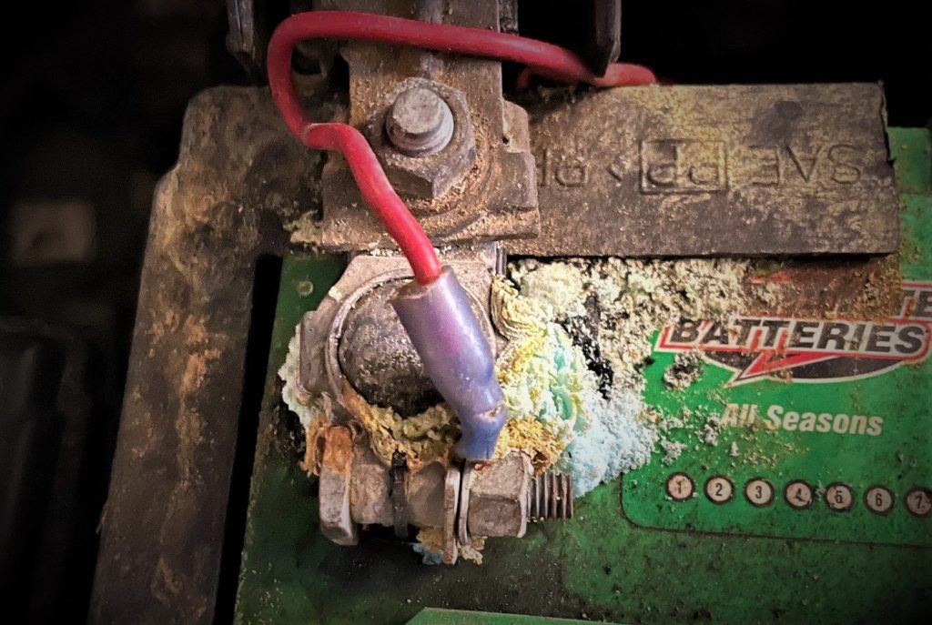 corroded automotive vehicle battery terminal