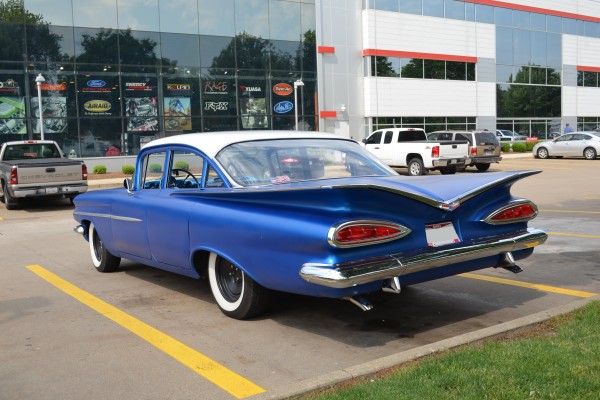 rear quarter view of a vintage chevy sedan hot rod