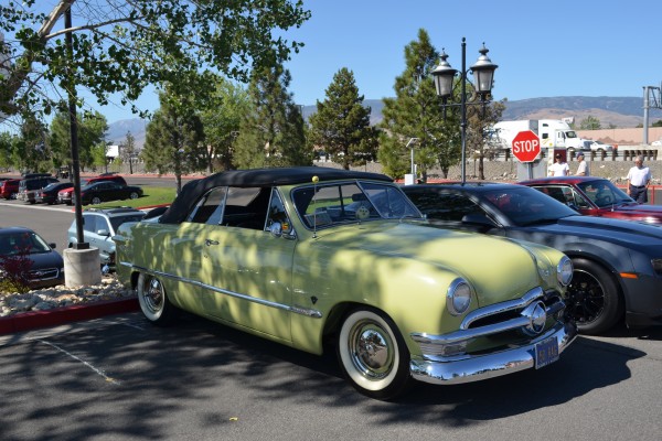 yellow ford shoebox convertible coupe at car show