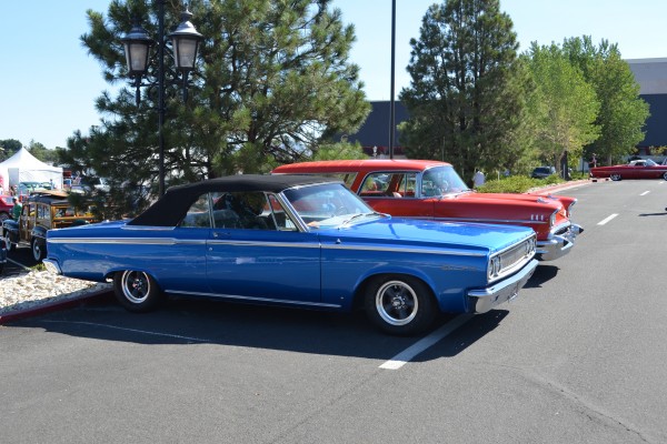 pair of classic cars at a local cruise in show