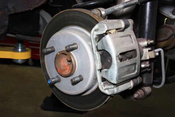 rear disc brake caliper on a ford mustang