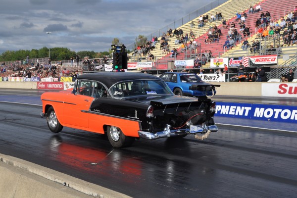 a 1955 chevy bel air drag car racing a fox body mustang