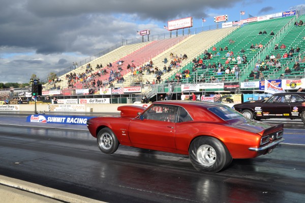 chevy camaro 1968 drag car launching at dragstrip