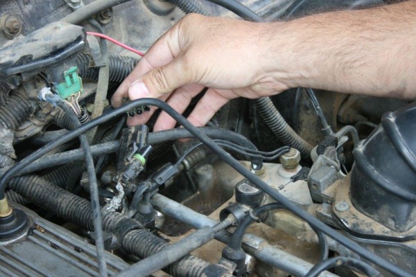 removing an electrical connector from a wire harness