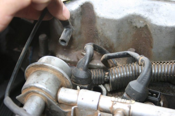 disconnecting a vacuum line on an engine
