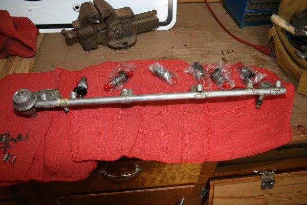 removing old fuel injectors from a fuel rail