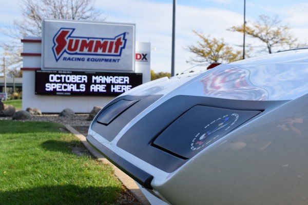 white 1970 Plymouth Superbird with summit racing sign