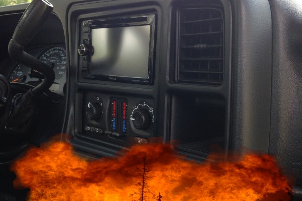 A Silverado truck dash with a cropped image of a fire