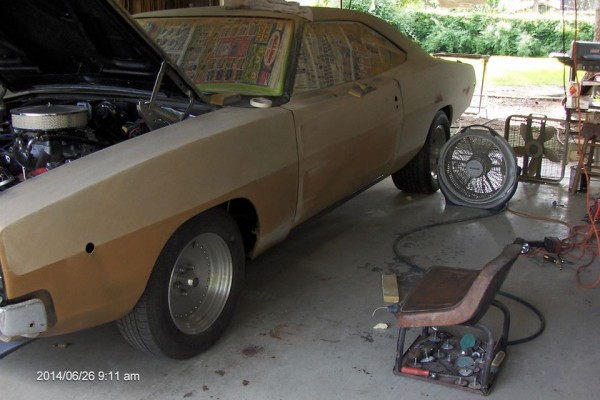 black 1968 dodge charger restomod in primer during restoration