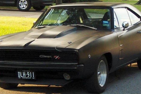 black 1968 dodge charger restomod parked on street