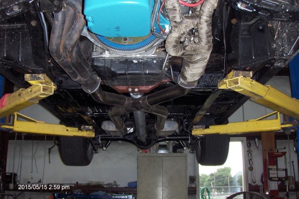 black 1968 dodge charger restomod on lift, underside