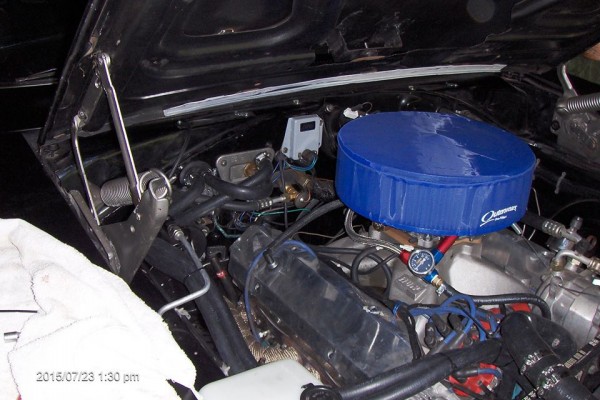 black 1968 dodge charger restomod engine bay with filter sock