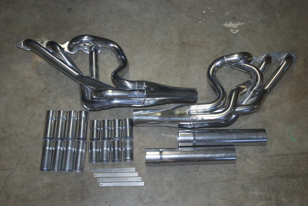 exhaust Header kit on a garage floor
