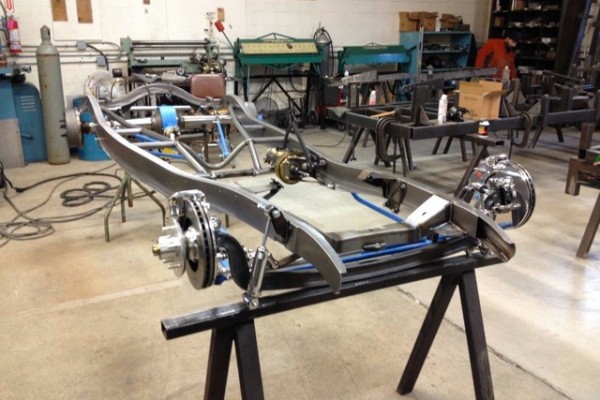 vehicle frame on stands in a shop for restoration