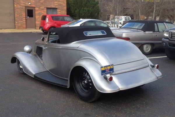 rear shot of a silver hotrod