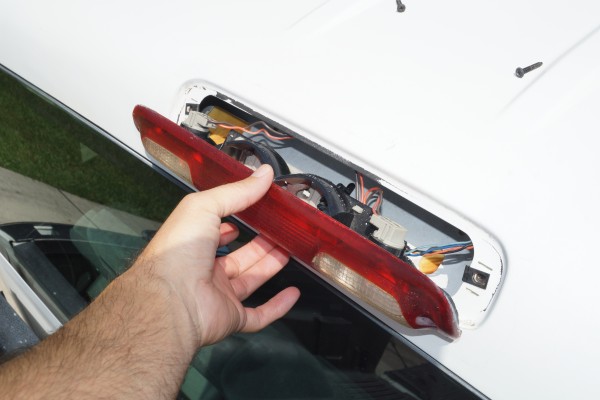 removing the rear third brake light from a silverado truck cab