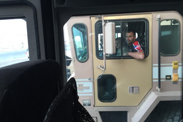 nhra driver driving a military truck